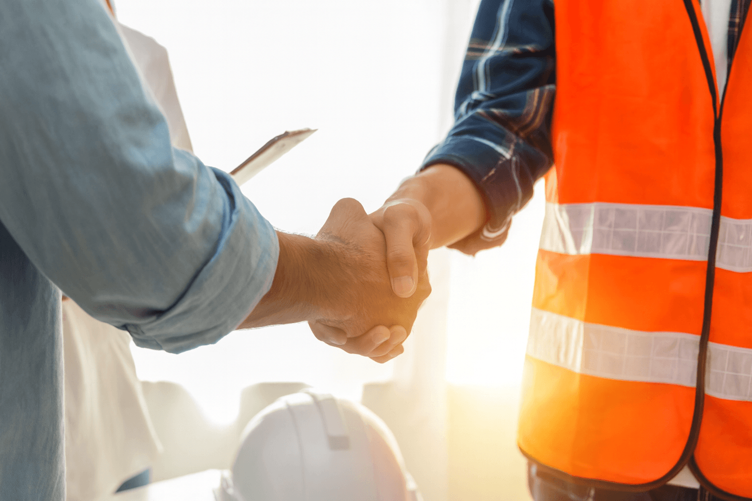Handshake between a homeowner and a contractor representing trust in our plastering services in Sutton Coldfield.