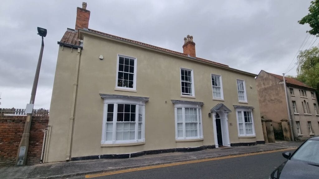 House coated with spray cork external insulation for thermal protection and improved appearance