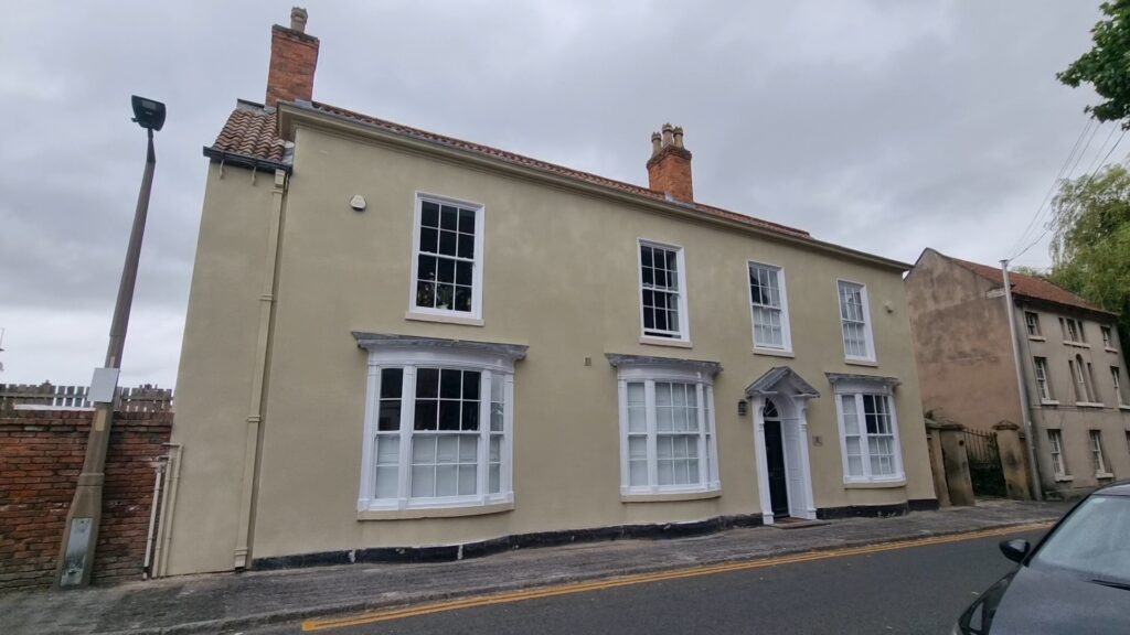 External cork coating sprayed onto house exterior improving protection and finish