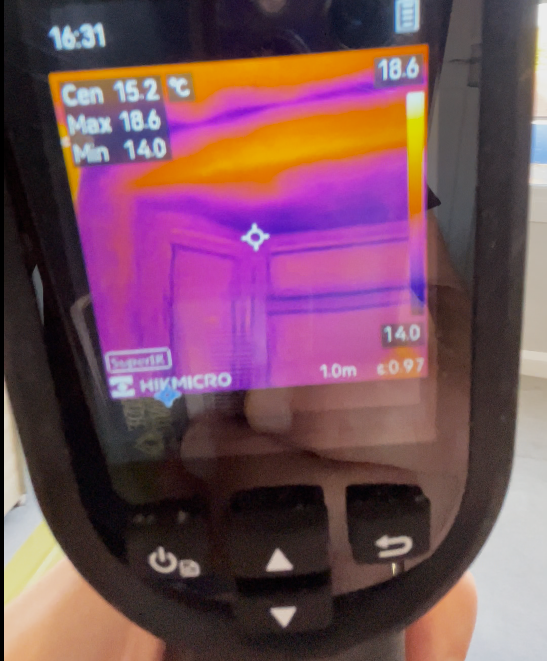 Thermal imaging showing heat loss and cold areas inside a poorly insulated room